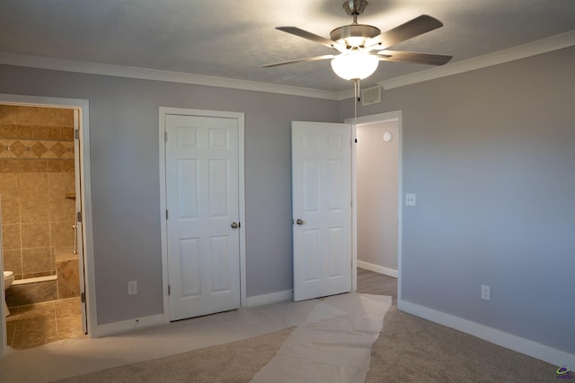 unfurnished bedroom with ceiling fan, crown molding, light carpet, and ensuite bath