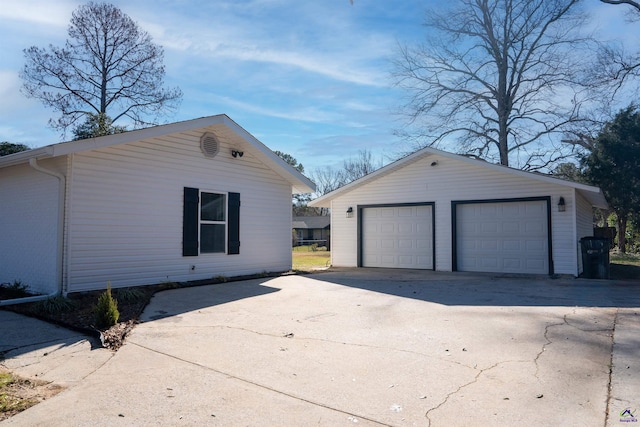 exterior space featuring an outdoor structure and a garage