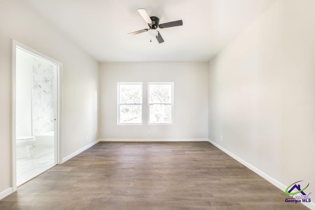 spare room with ceiling fan and hardwood / wood-style floors