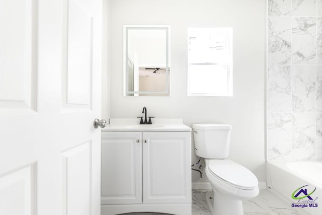 full bathroom featuring toilet, vanity, and shower / bathtub combination