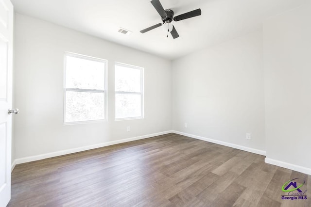 spare room with ceiling fan and hardwood / wood-style floors