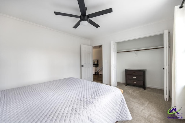 bedroom with ceiling fan, a closet, and light carpet