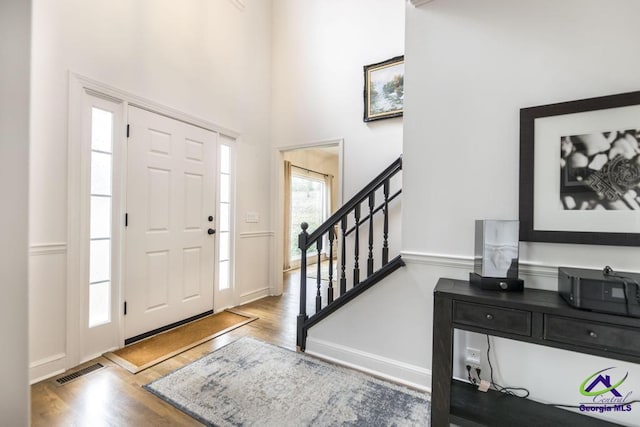 entrance foyer featuring hardwood / wood-style flooring