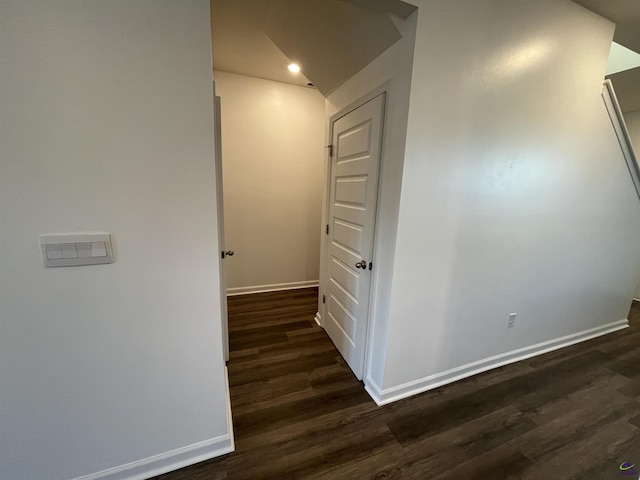 hallway with dark hardwood / wood-style flooring