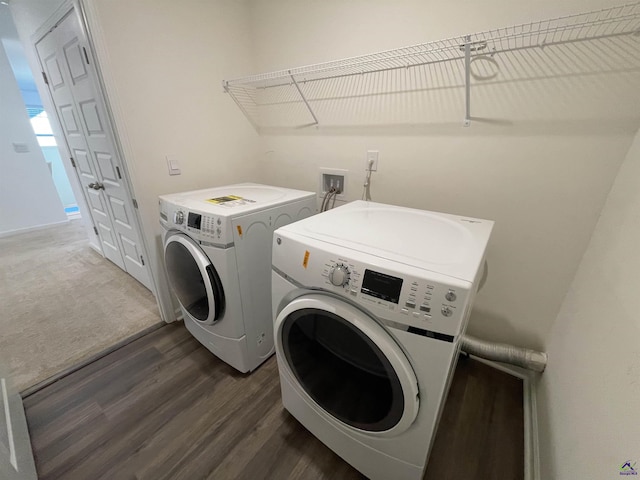 washroom featuring separate washer and dryer and dark hardwood / wood-style floors