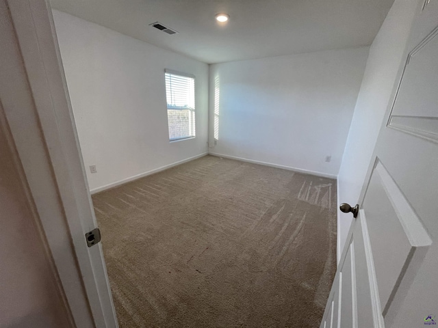 spare room featuring carpet floors