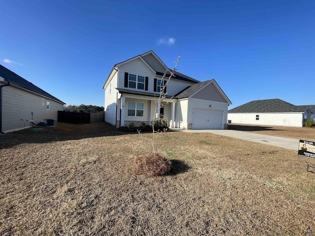 front facade with a garage, a front lawn, and central air condition unit