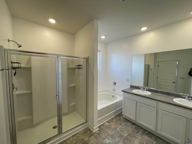 bathroom featuring vanity and plus walk in shower