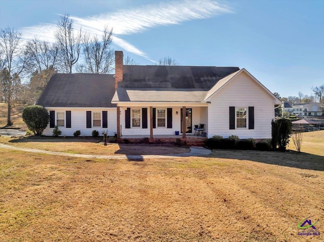 single story home with a porch and a front yard