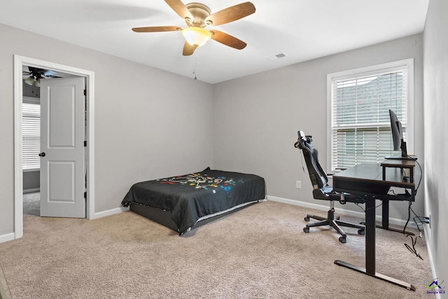 carpeted bedroom with ceiling fan