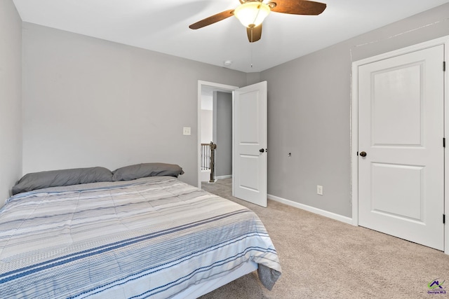 bedroom with ceiling fan and light colored carpet