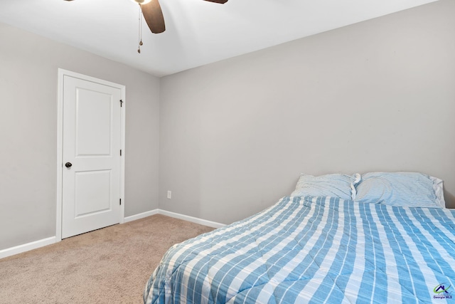 bedroom featuring light colored carpet and ceiling fan