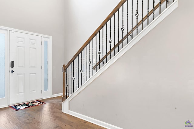 entryway with hardwood / wood-style floors