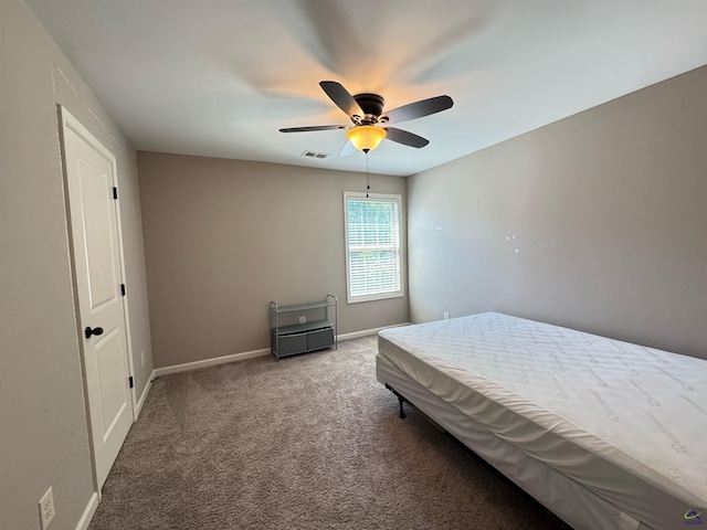 bedroom with baseboards, a ceiling fan, carpet flooring, and visible vents