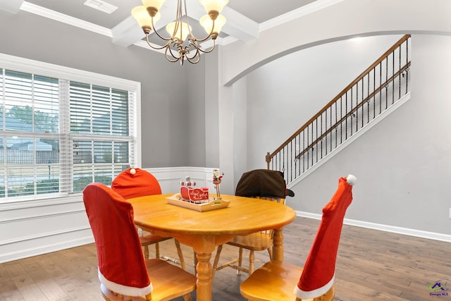 dining space with a chandelier, dark hardwood / wood-style floors, and ornamental molding