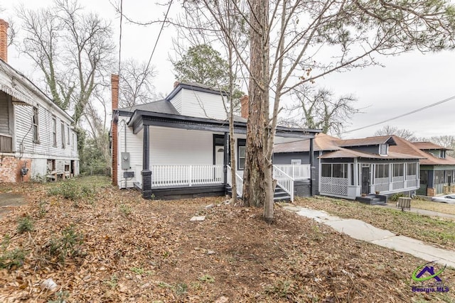 bungalow-style home with a sunroom and a porch