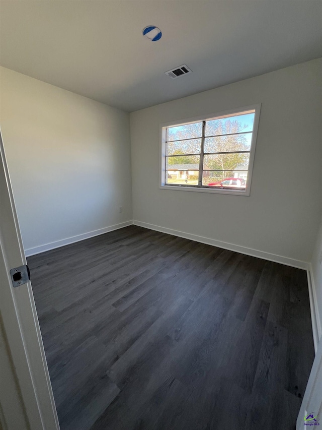 empty room featuring dark hardwood / wood-style floors