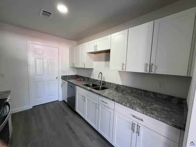 kitchen featuring dishwasher, sink, dark hardwood / wood-style flooring, dark stone counters, and white cabinets