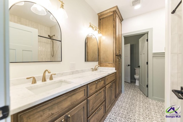 bathroom featuring vanity and toilet