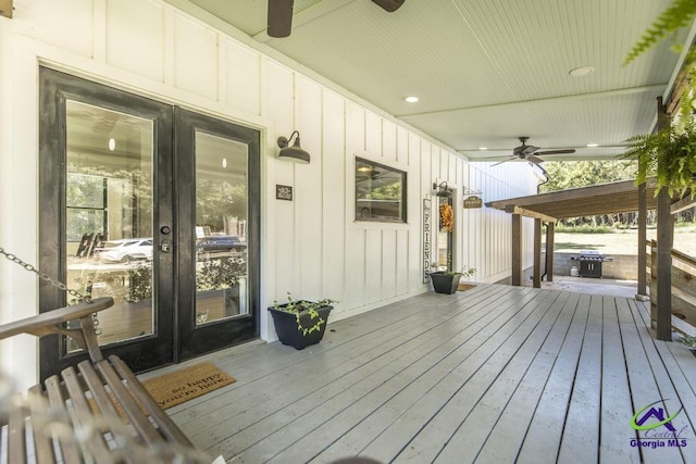 deck with french doors and ceiling fan