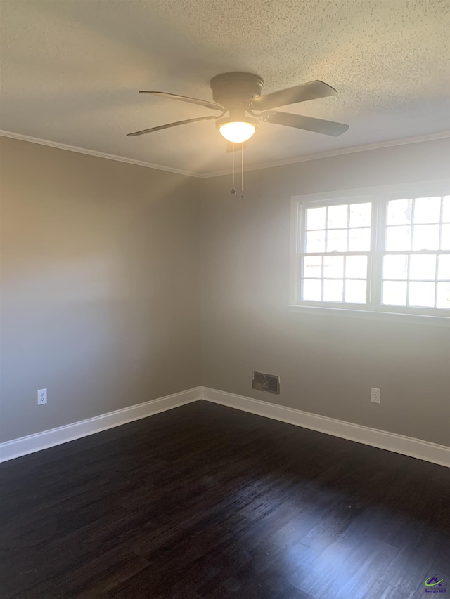 spare room with crown molding, ceiling fan, dark hardwood / wood-style flooring, and a textured ceiling