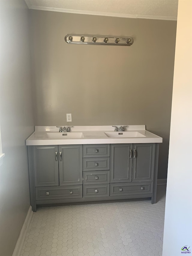 bathroom featuring vanity, tile patterned floors, and crown molding