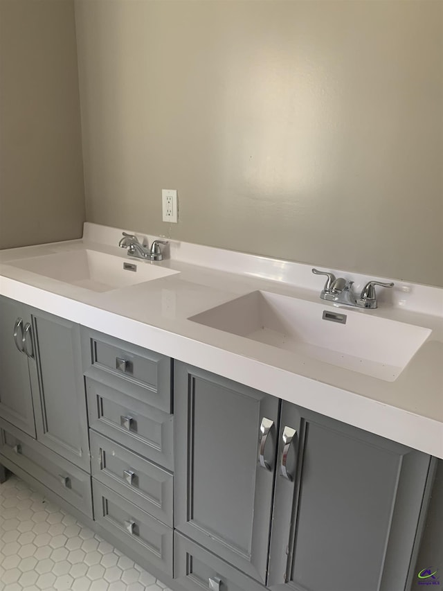 bathroom featuring tile patterned flooring and vanity