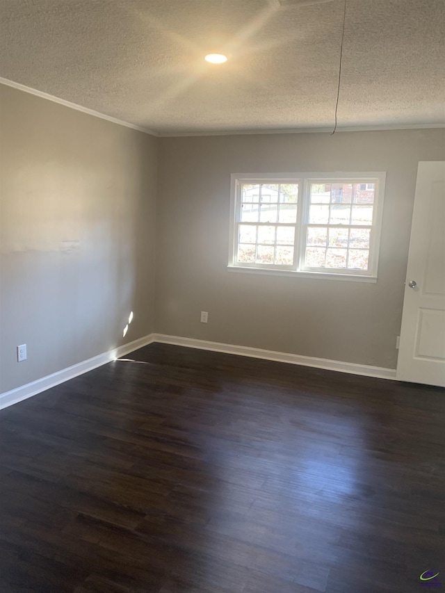 unfurnished room featuring dark hardwood / wood-style floors and a textured ceiling