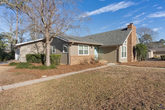 ranch-style house with a front lawn