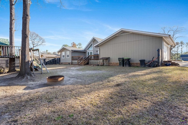 exterior space featuring a lawn and a deck