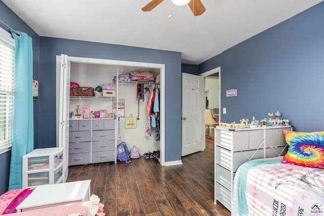 bedroom featuring a closet, ceiling fan, and dark wood-type flooring