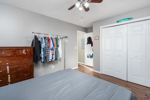 unfurnished bedroom with ceiling fan, a closet, and hardwood / wood-style floors