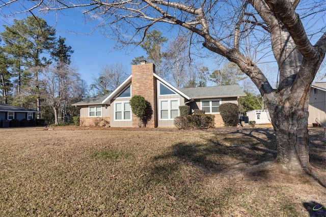 back of house with a yard