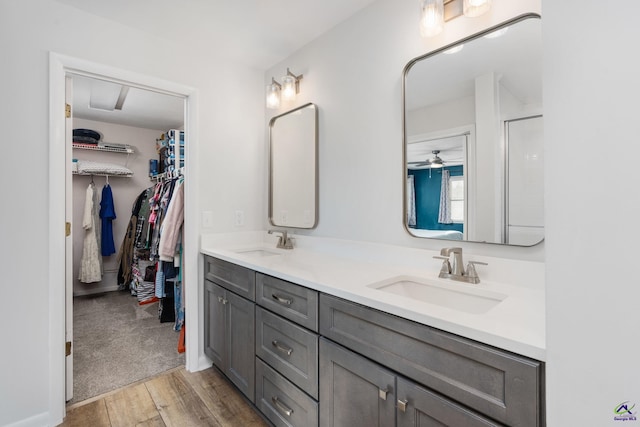 bathroom featuring vanity and ceiling fan