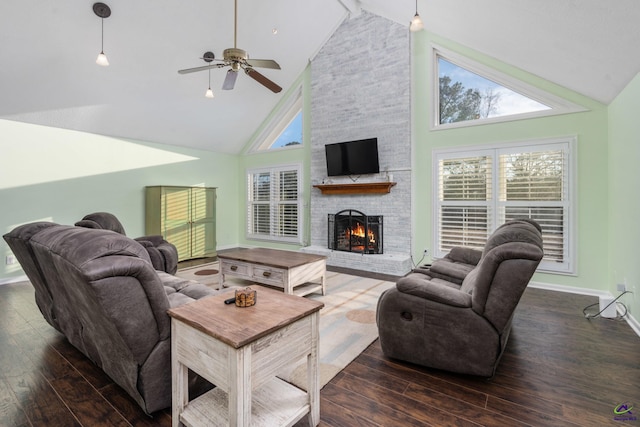 living room with ceiling fan, dark hardwood / wood-style flooring, and high vaulted ceiling