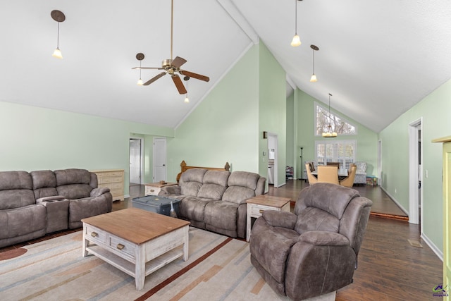 living room featuring high vaulted ceiling, ceiling fan with notable chandelier, and wood-type flooring