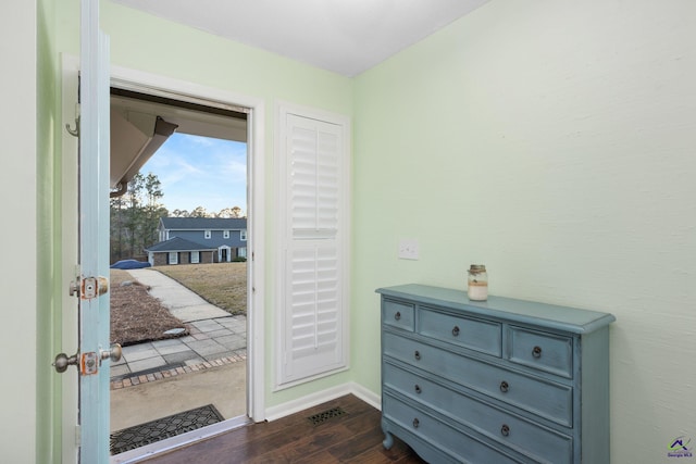 doorway with dark hardwood / wood-style floors