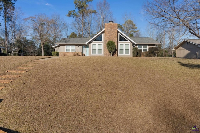 rear view of house with a lawn