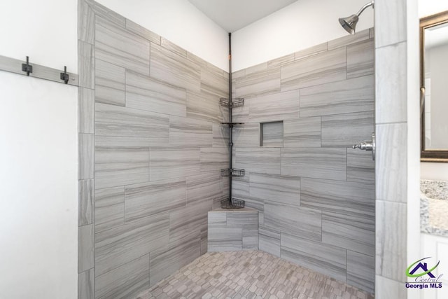 bathroom with tiled shower