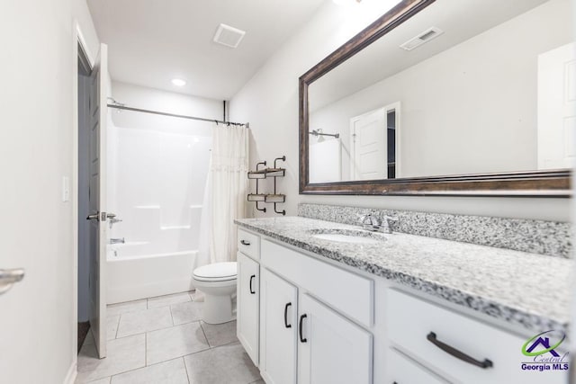 full bathroom featuring vanity, shower / tub combo with curtain, tile patterned floors, and toilet