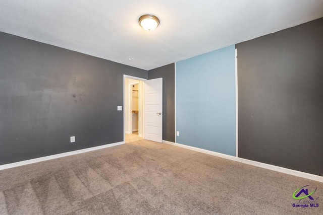 empty room with light colored carpet