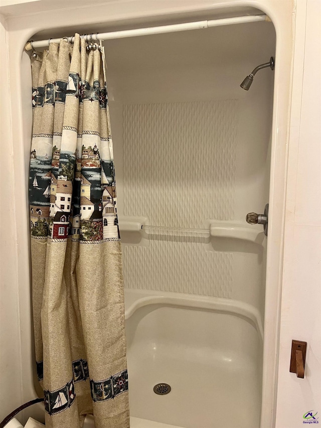 bathroom featuring walk in shower