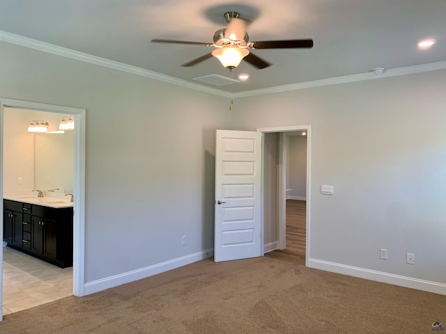 unfurnished bedroom with ceiling fan, ensuite bathroom, crown molding, and light carpet