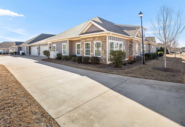 view of front of property with cooling unit and a garage