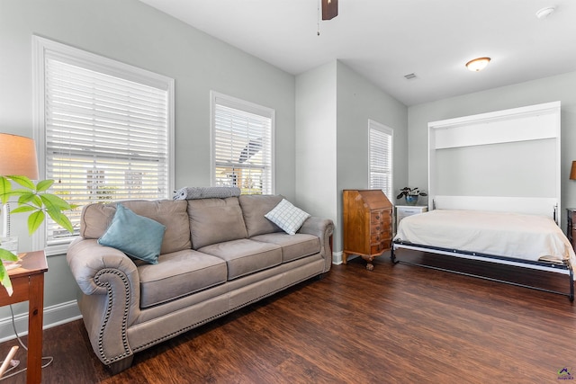 bedroom featuring dark hardwood / wood-style flooring and ceiling fan