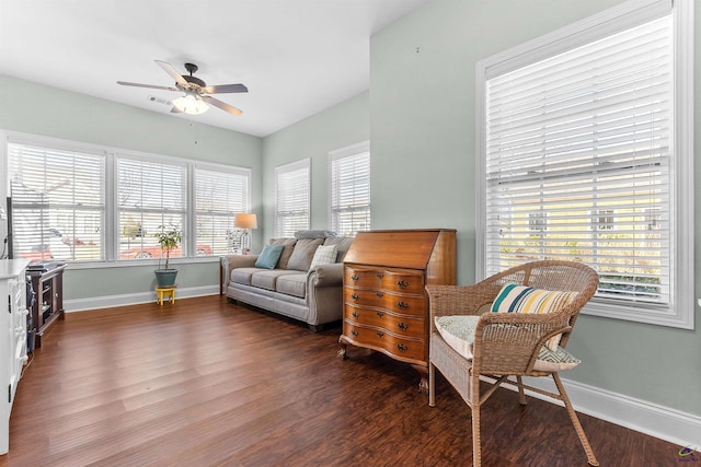 sitting room with dark hardwood / wood-style floors and ceiling fan