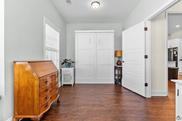 interior space with dark hardwood / wood-style floors