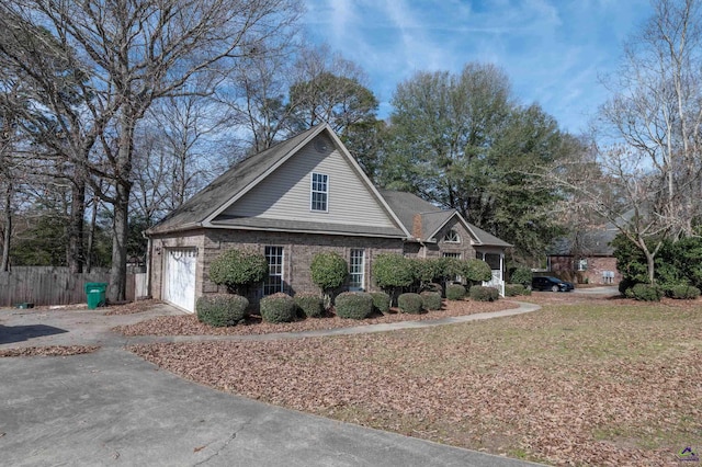 view of side of home with a garage