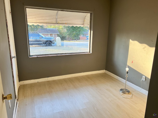 spare room featuring hardwood / wood-style floors