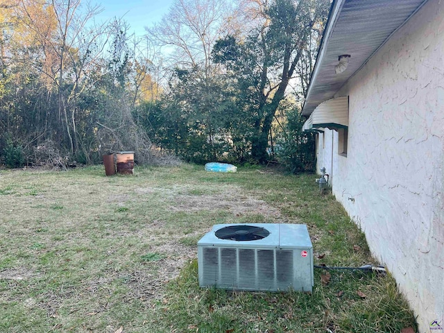 view of yard with central AC unit